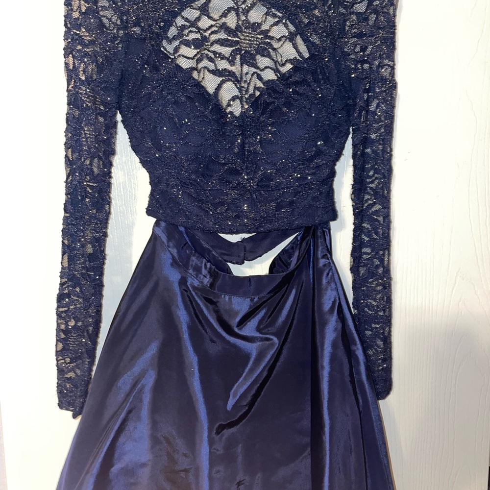 Navy blue Windsor two piece dress. Long sleeves with pockets and open back